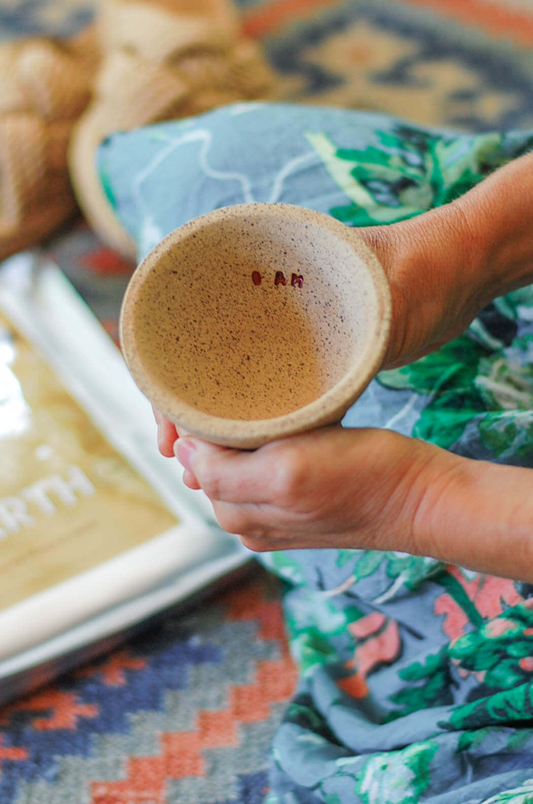 woman holding a cup of cacao