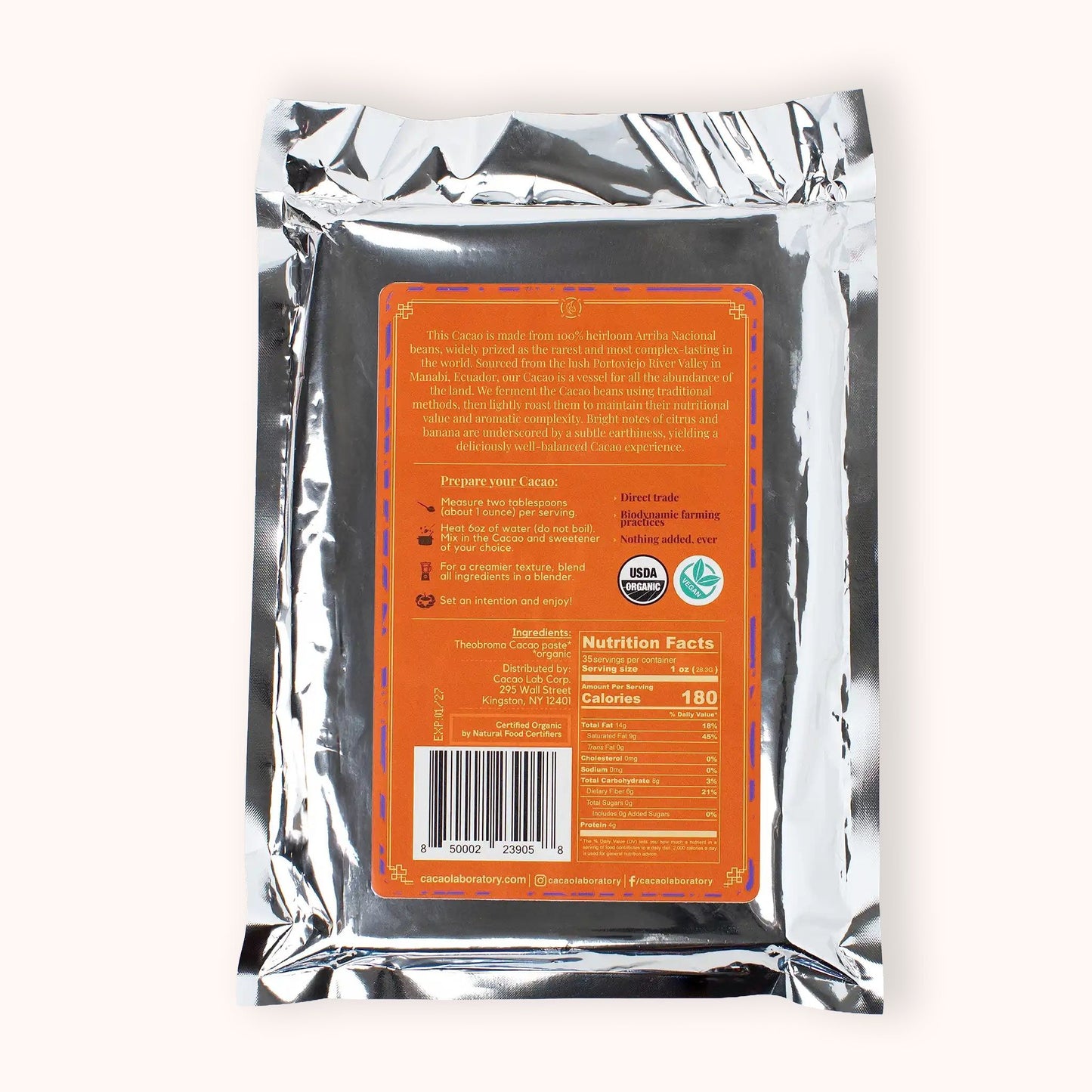 Cacao Laboratory ceremonial cacao block back with orange label and silver packaging on a white background