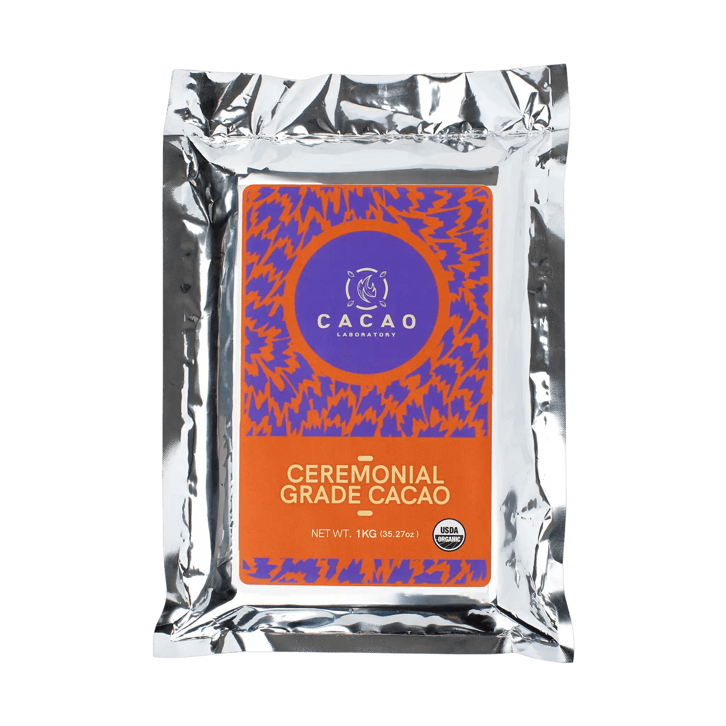 A silver foil pouch of Cacao Laboratory Ceremonial Grade Cacao, featuring a prominent orange and purple label on a solid black background.