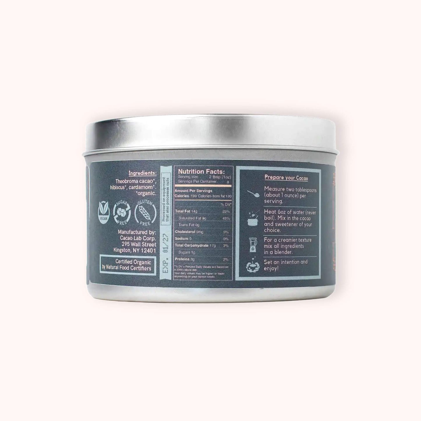 The back of a silver metal tin canister for cacao laboratory air blend ceremonial cacao, showing the ingredients, nutrition facts, and reverse side instructions on a light cream background.