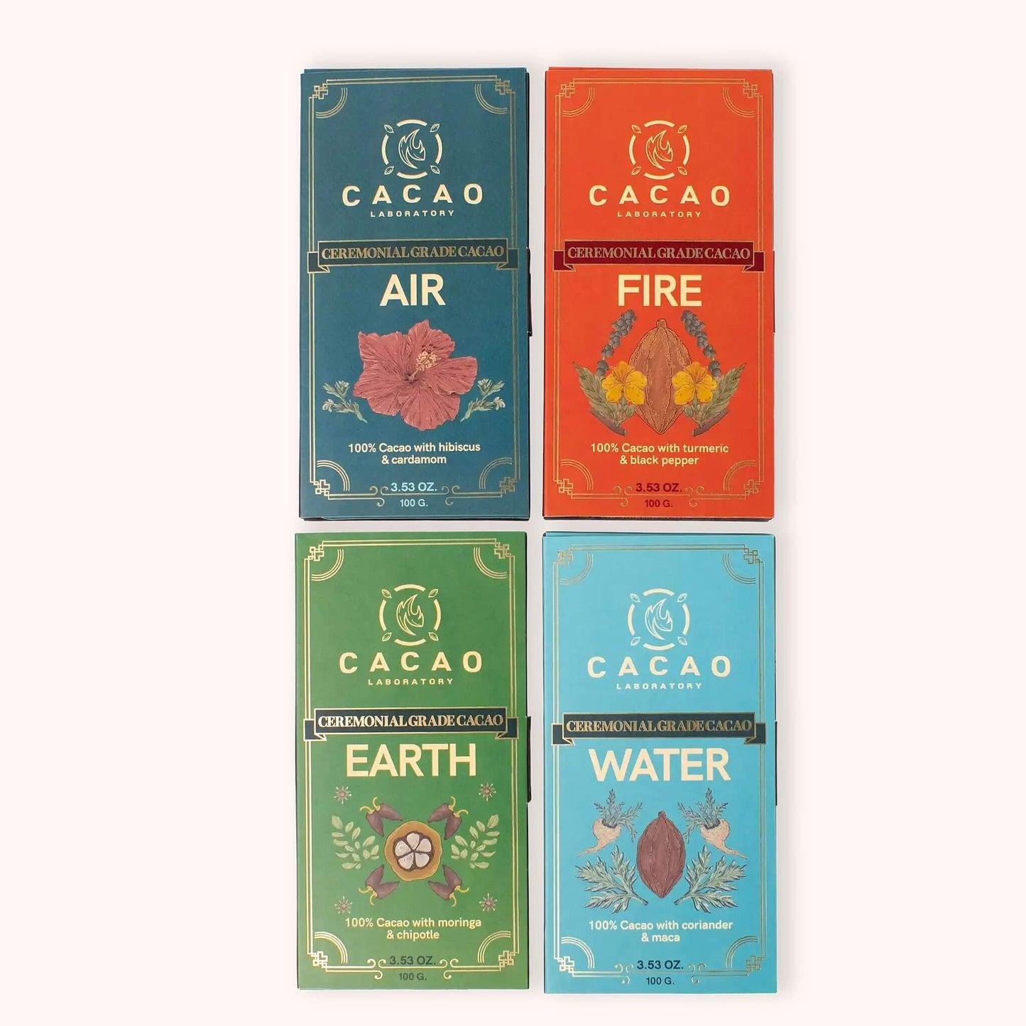 Four Cacao Laboratory ceremonial grade cacao bars arranged in a 2x2 grid on a light beige background. The packages are colored teal, orange, green, and light blue, each with gold foil details and a different botanical illustration labeled Air, Fire, Earth, and Water.