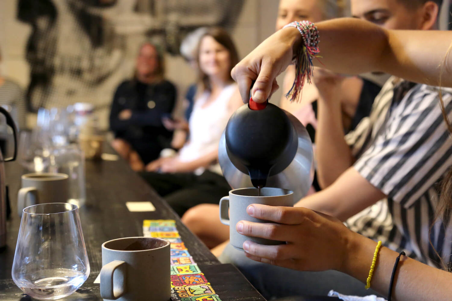 Pouring a cacao at a corporate cacao ceremony