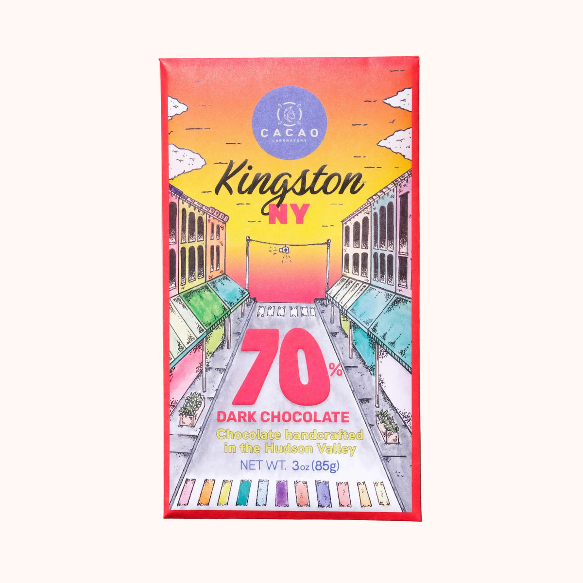 A Cacao Laboratory chocolate bar packaging with a colorful illustration of a street scene in Kingston, NY, and text indicating 70% dark chocolate
